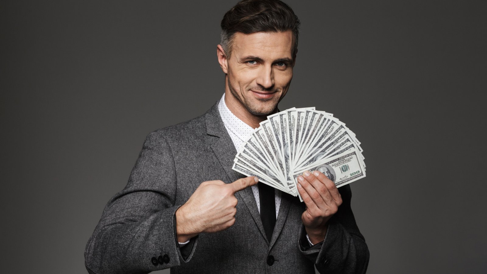 male in suit money fan cash dean drobot shutterstock