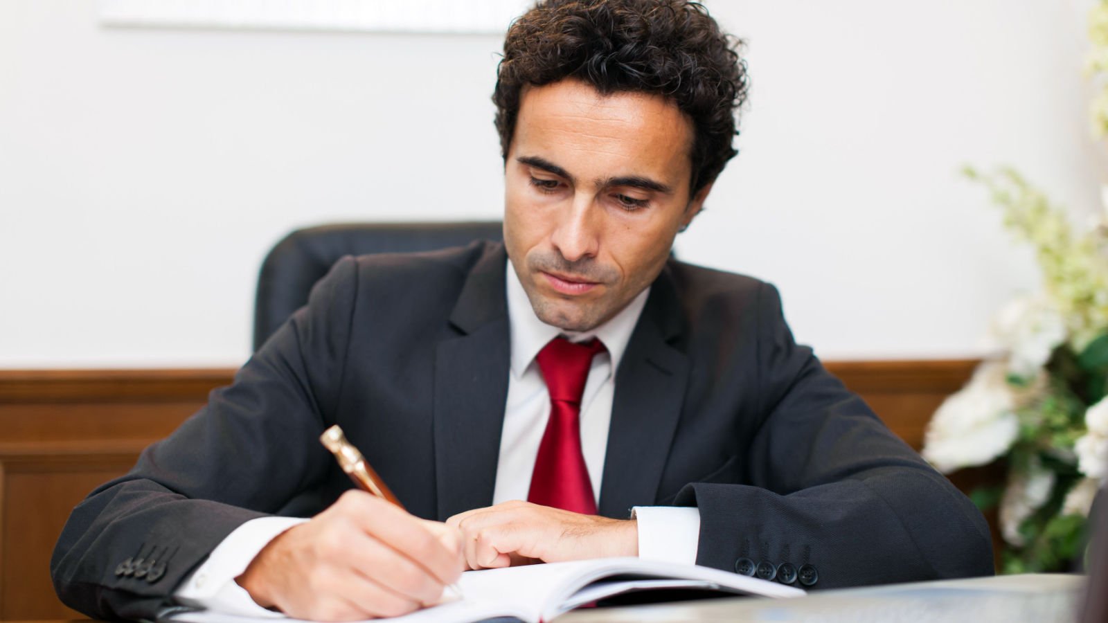 male lawyer reading paperwork writing will minerva studio shutterstock