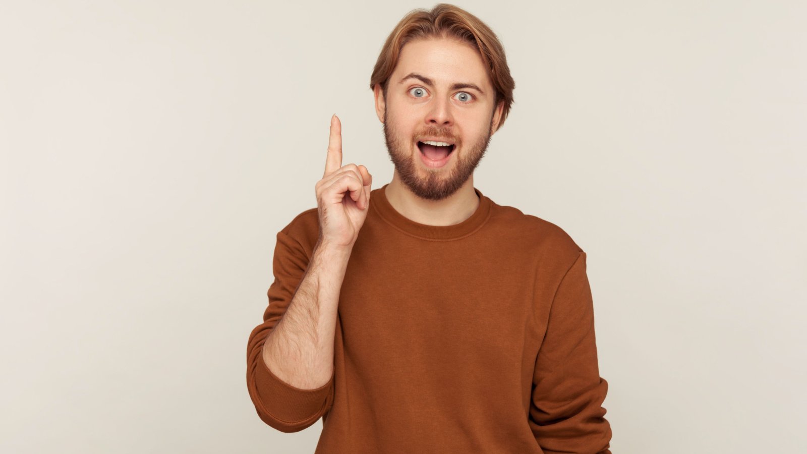 male raising finger pointing idea khosro shutterstock