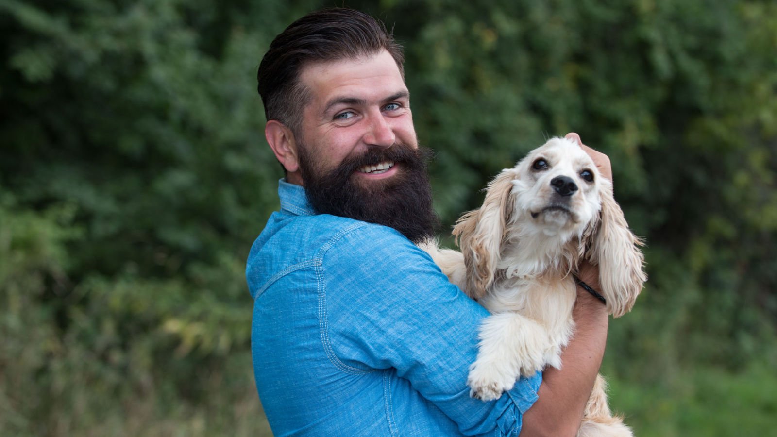 male with dog volodymyr shutterstock