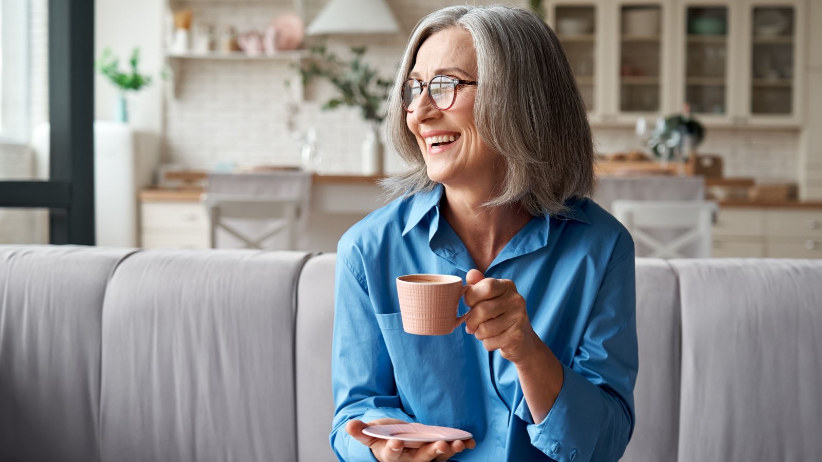 mature older senior woman home cozy on couch ground picture shutterstock