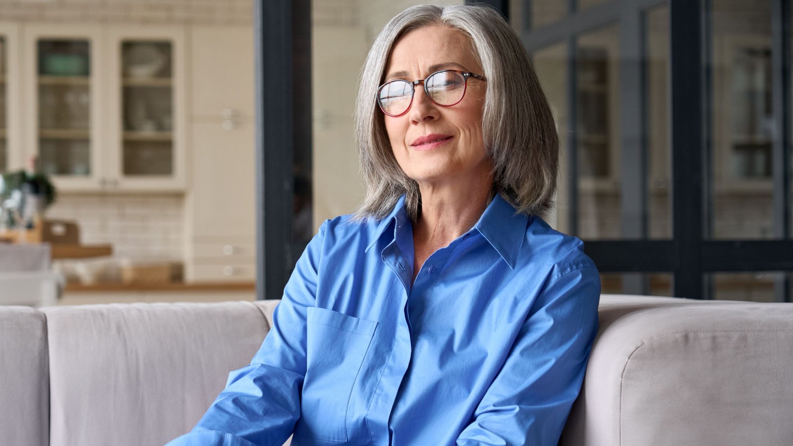 mature older senior woman sitting on sofa boss mother ground picture shutterstock