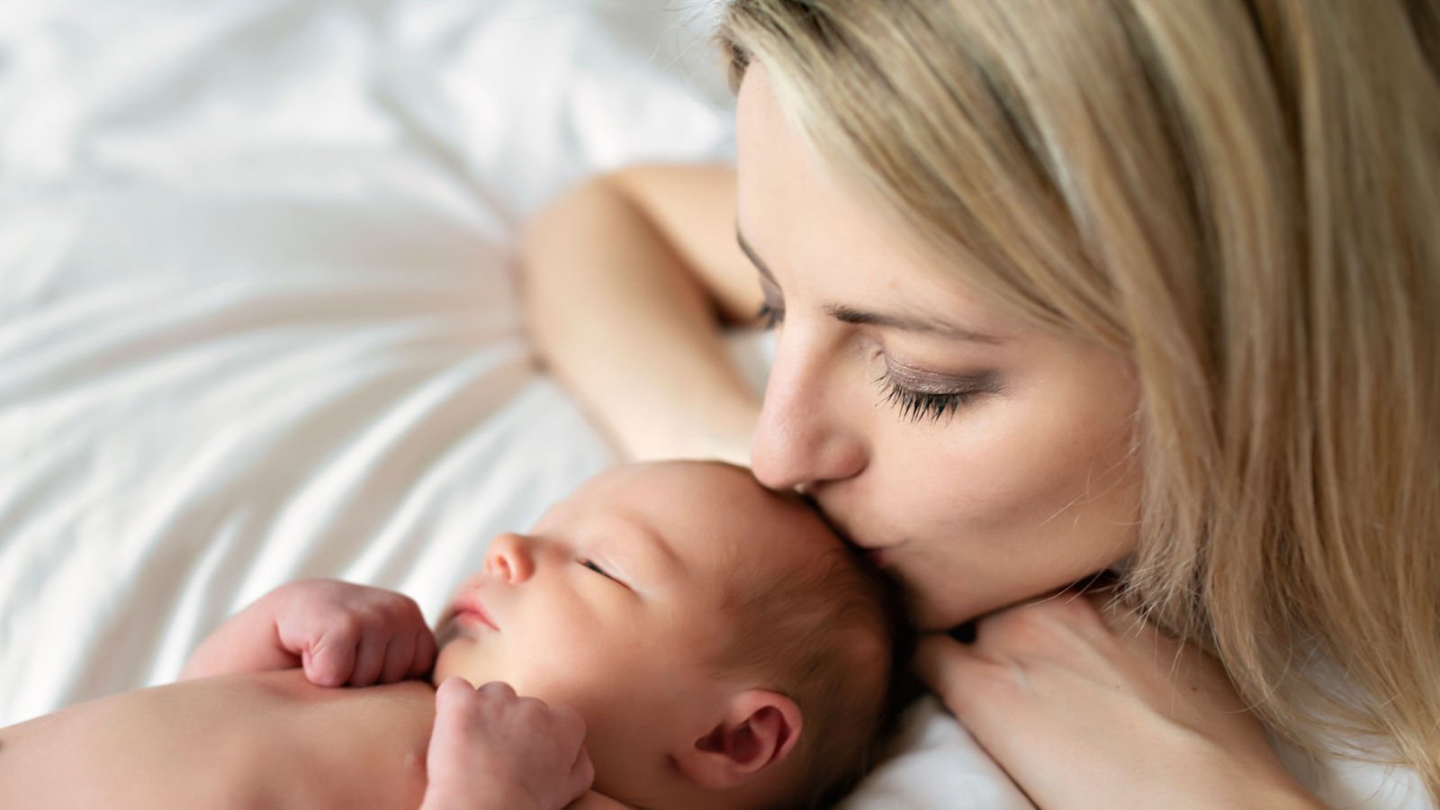 mother with newborn baby infant lopolo shutterstock