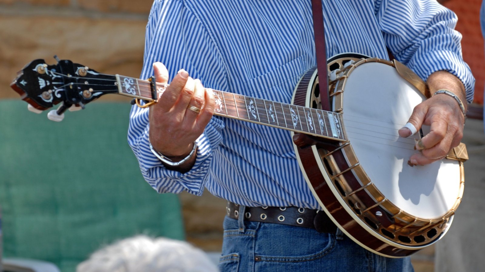 musician playing a banjo country music Kaviyas Gallery Shutterstock musician playing a banjo country music Kaviyas Gallery Shutterstock