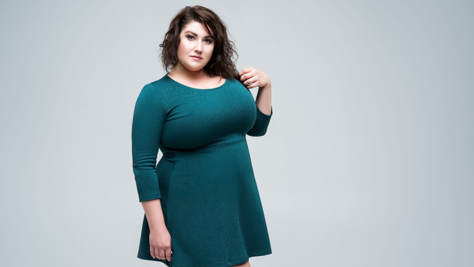 plus size lady green dress staras shutterstock