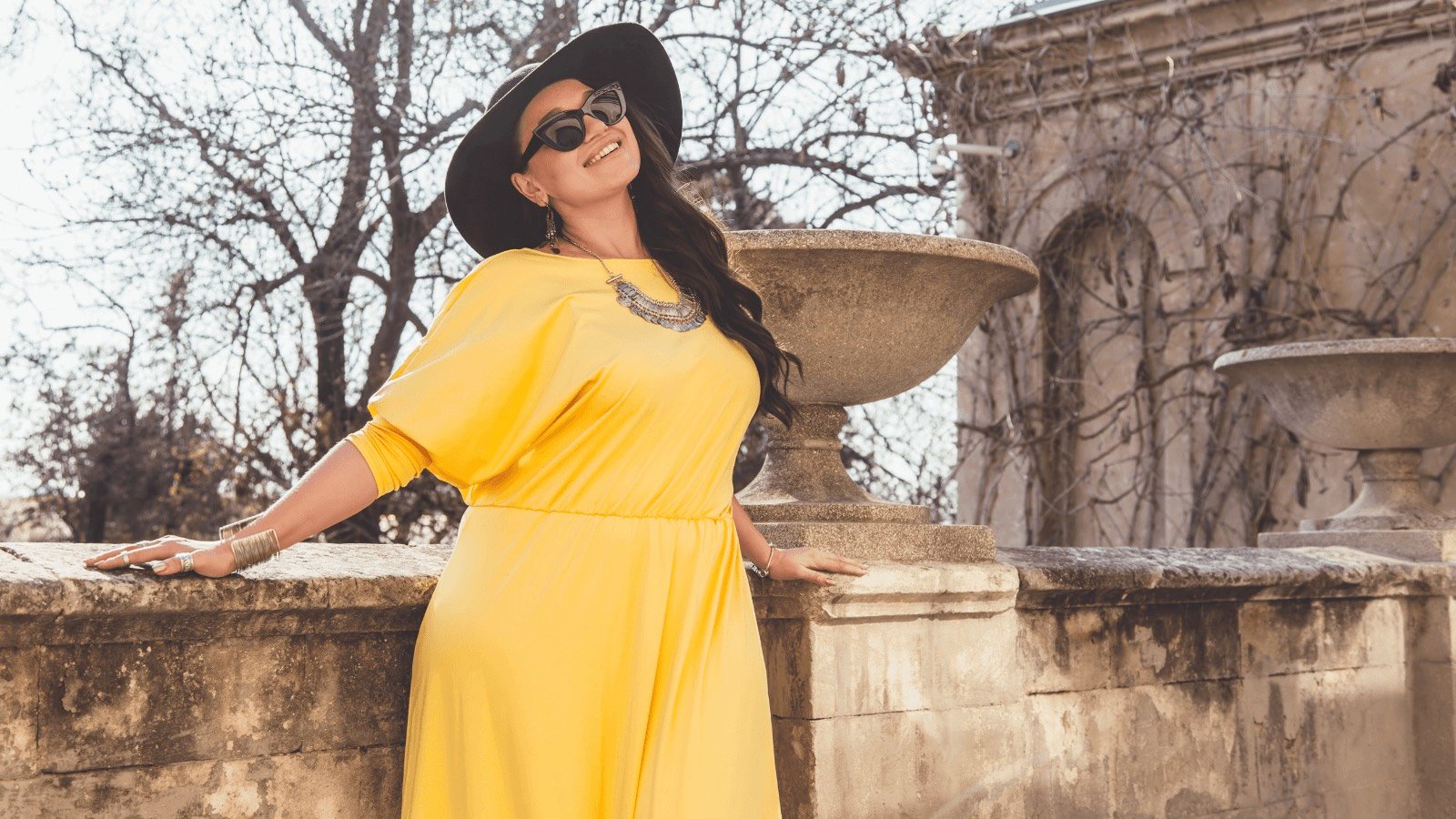 plus size lady yellow dress alena ozerova shutterstock