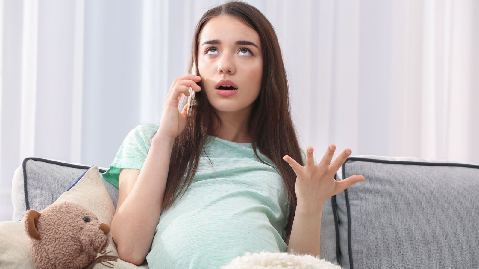 pregnant woman talking at home africa studio shutterstock