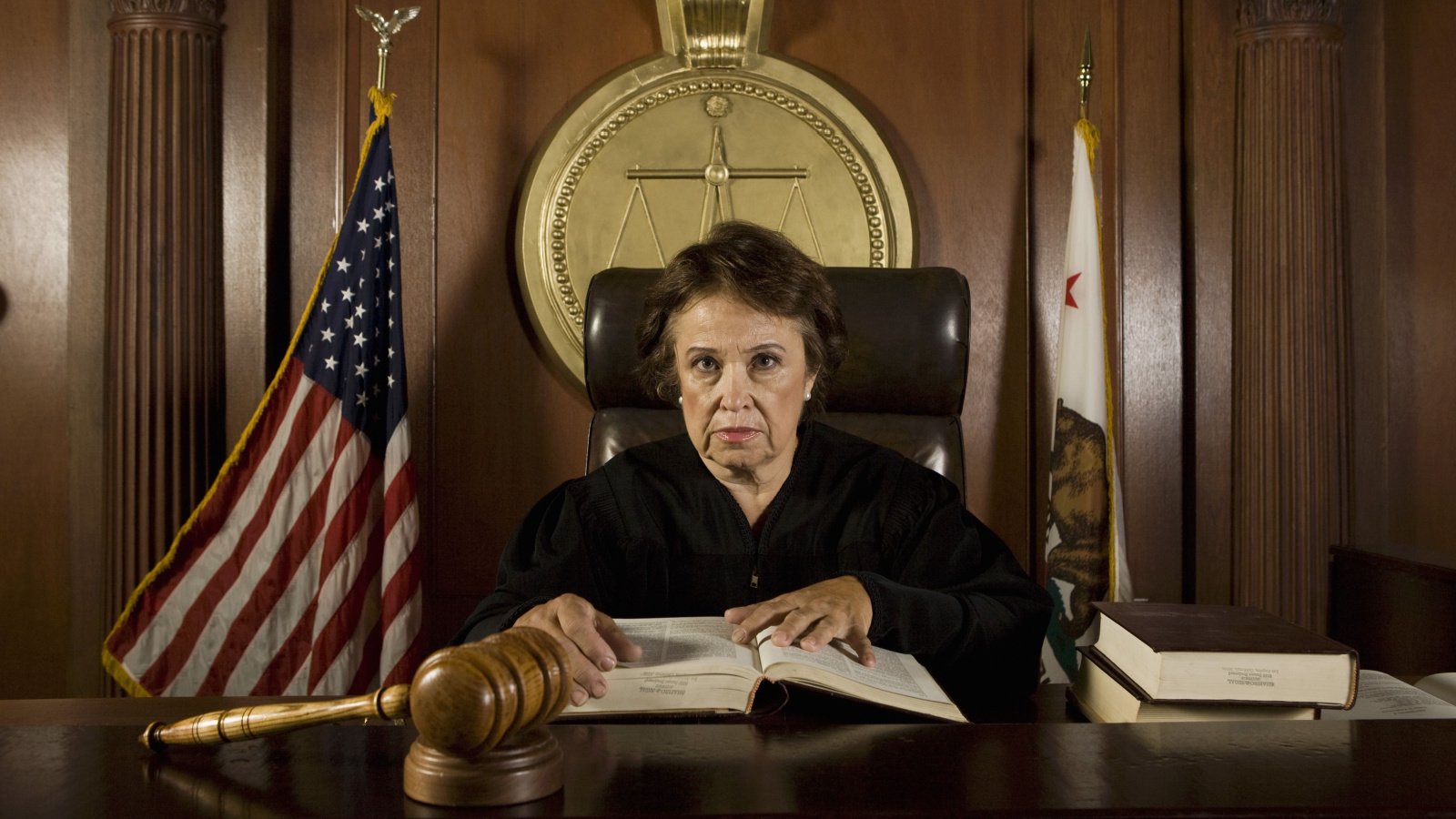 senior judge holding book in courtroom legal lawyer sirtravelalot shutterstock