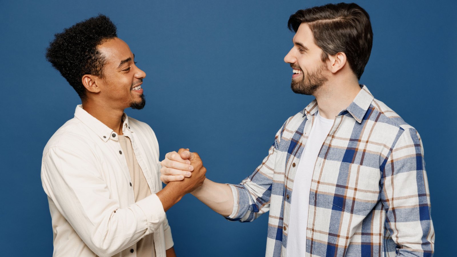 two friends buddies guys shaking hands vidl studio shutterstock