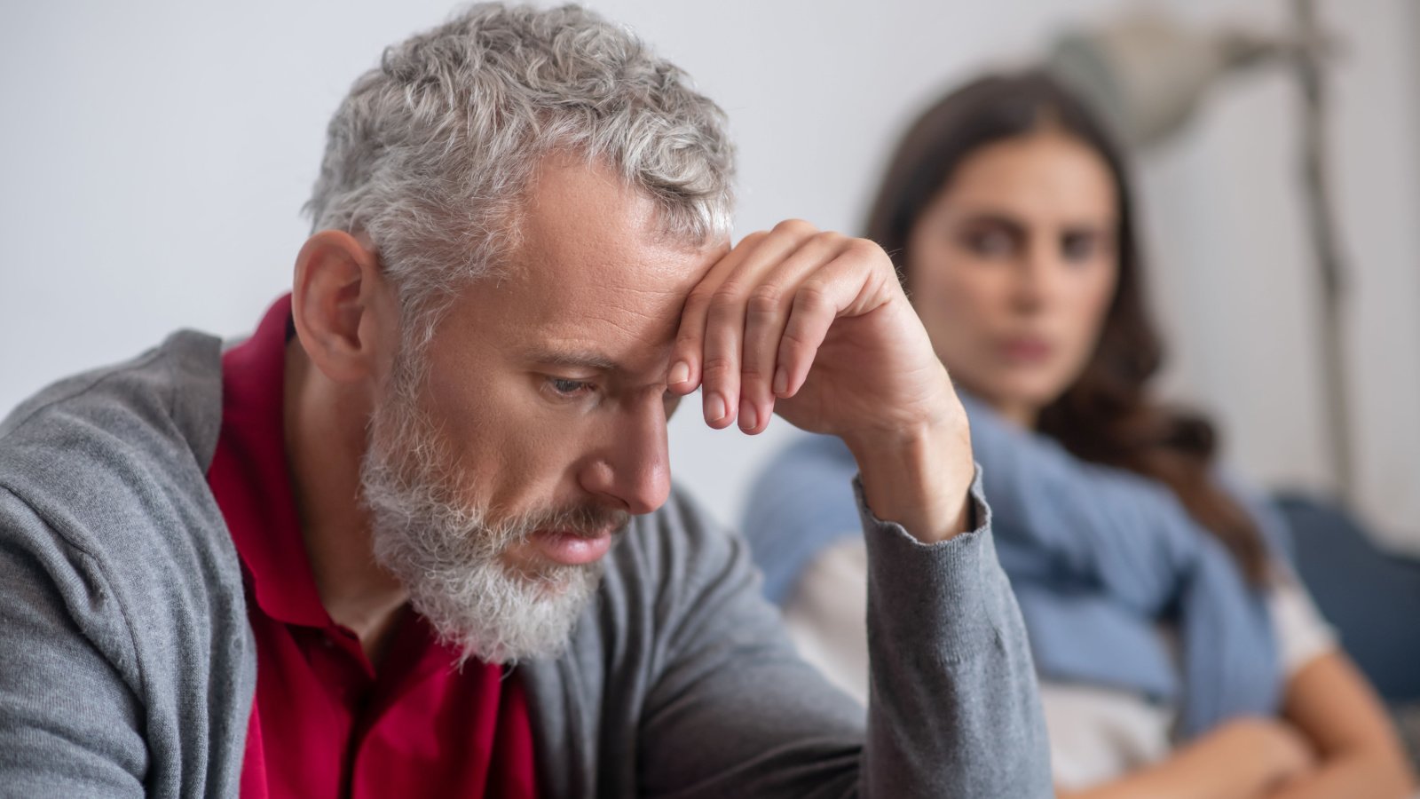 upset father man sitting on a sofa after an argument daughter dmytro zinkevych shutterstock