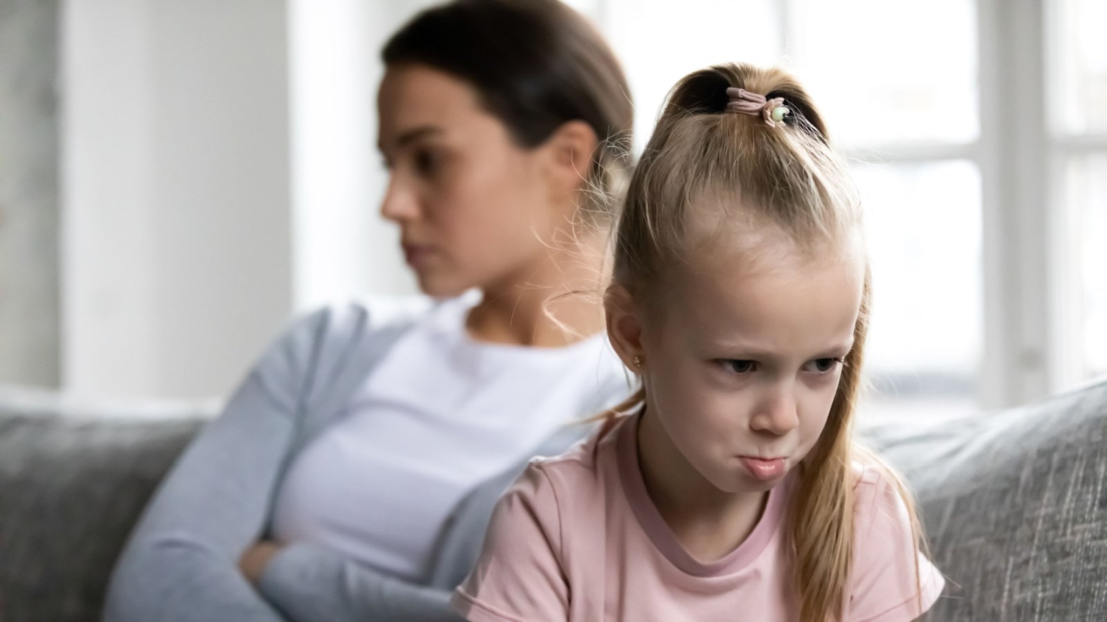 upset quiet mother and kid child girl daughter fight fizkes shutterstock