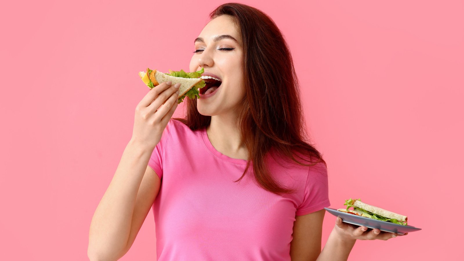 woman eating sandwich Pixel Shot shutterstock