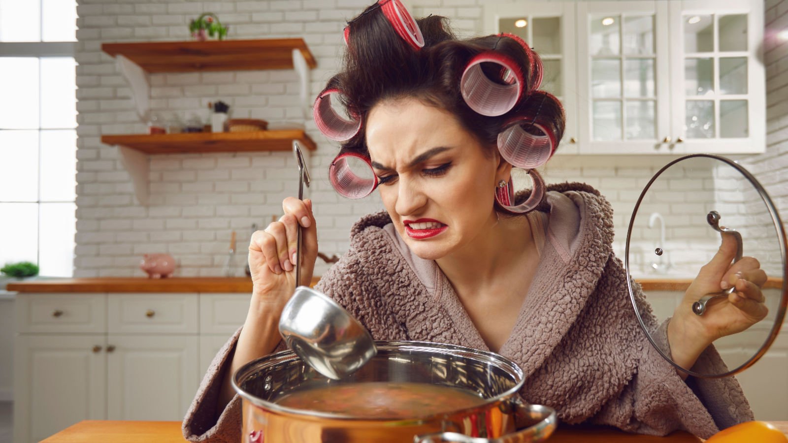 woman hair curlers housewife cooking food for the first time studio romantic shutterstock