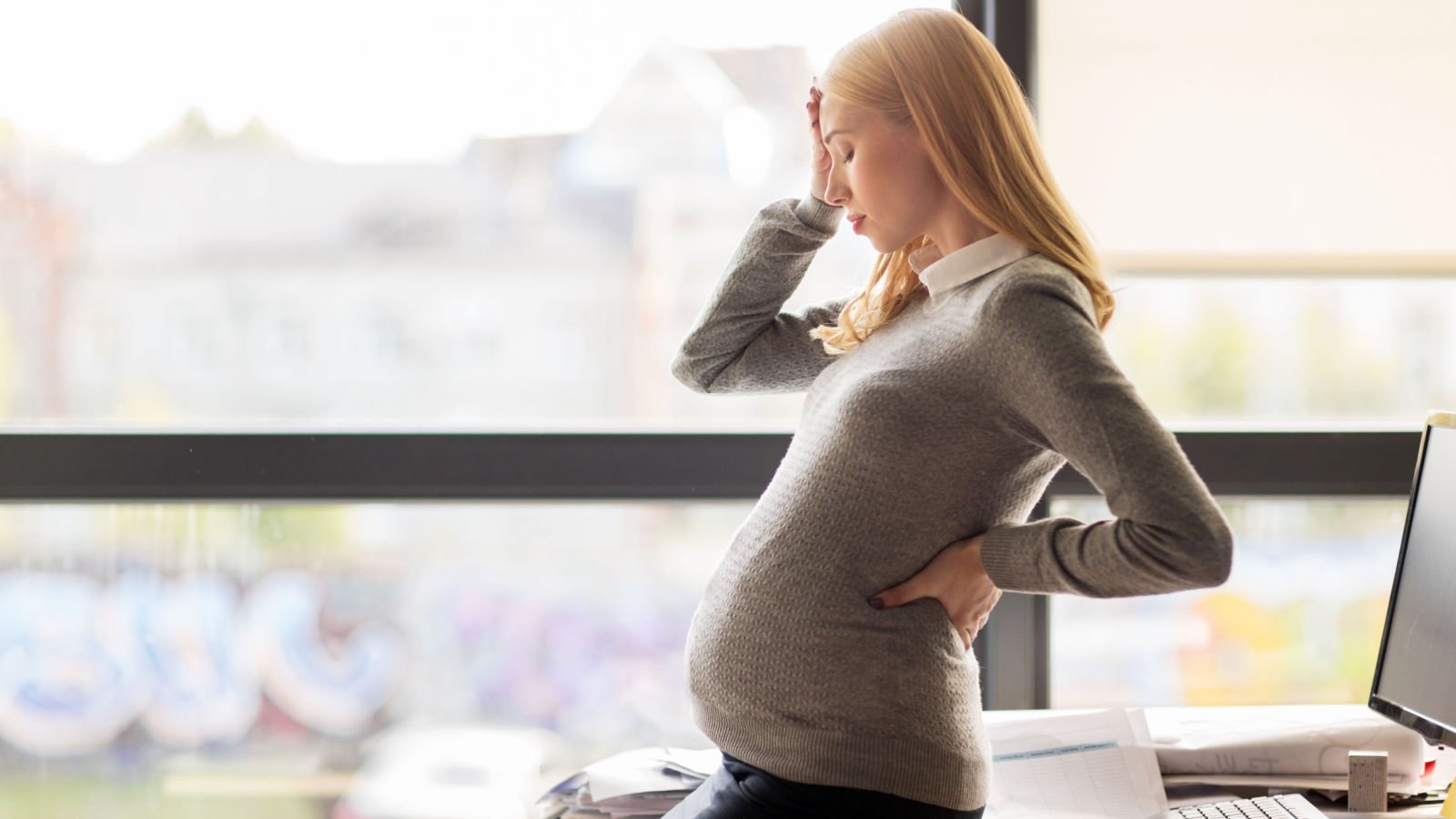 woman pregnant stressed sad ground picture shutterstock