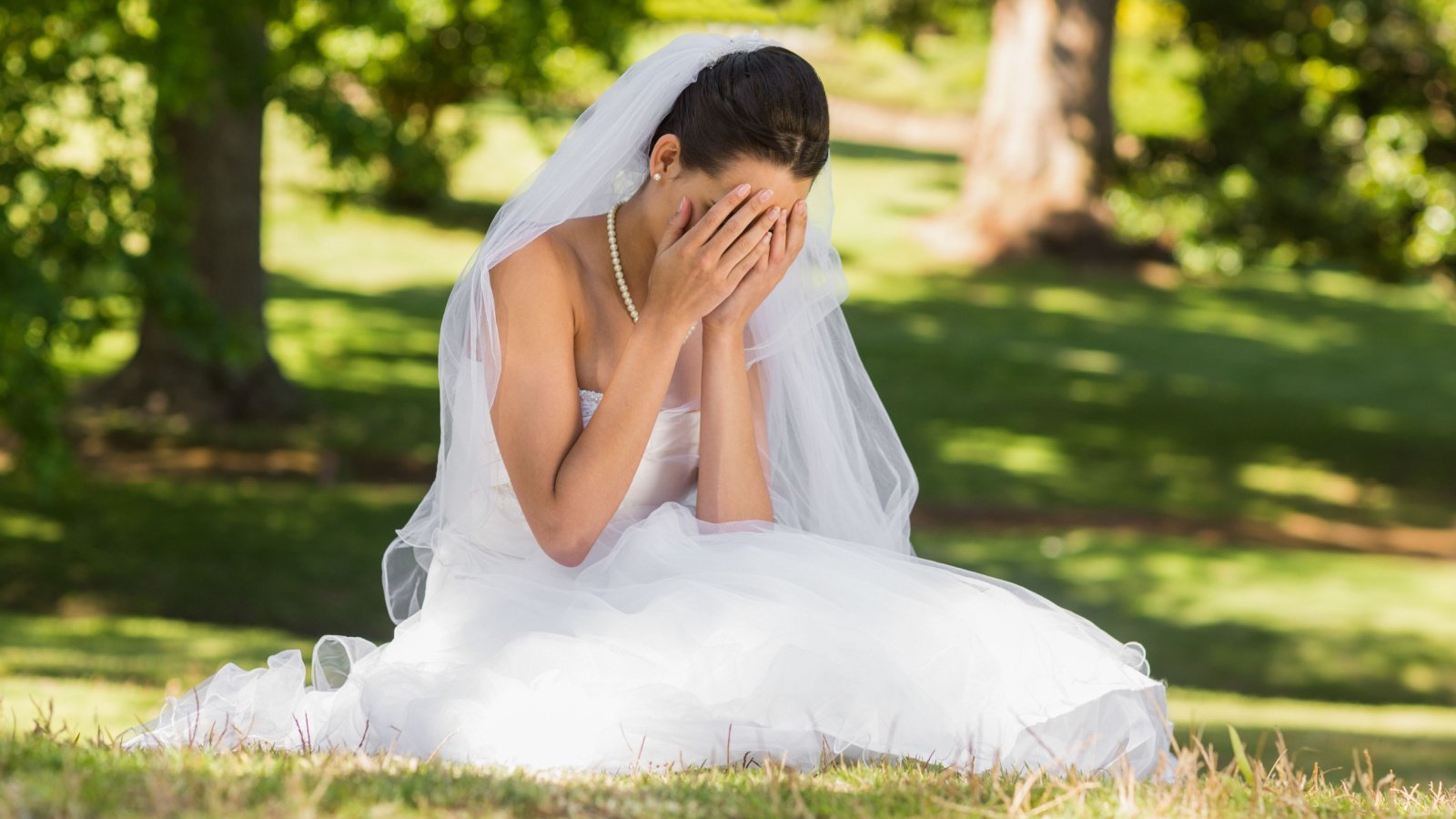 worried sad bride crying outdoors wavebreakmedia shutterstock