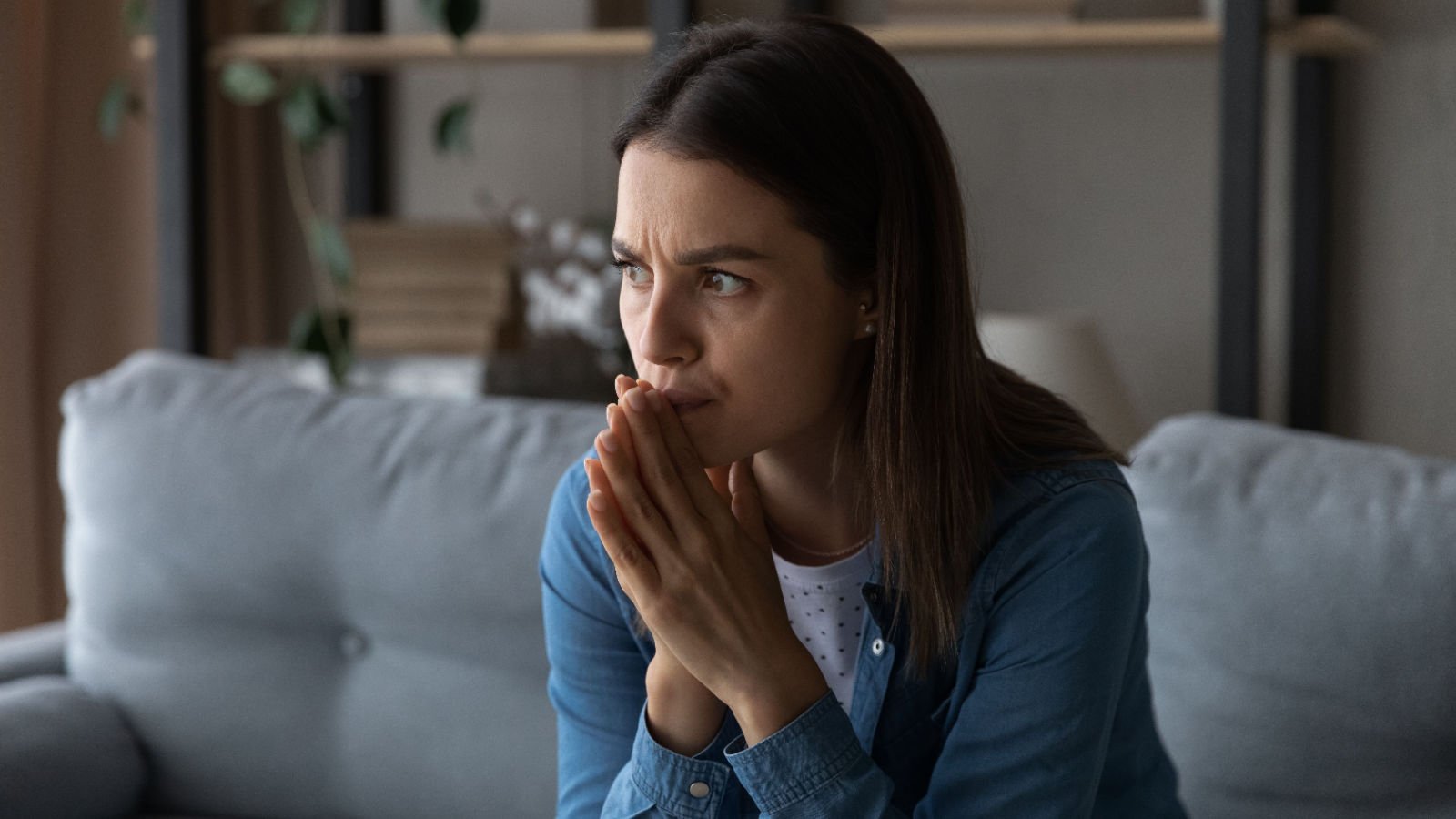 worried young woman thinkng nervous fizkes shutterstock