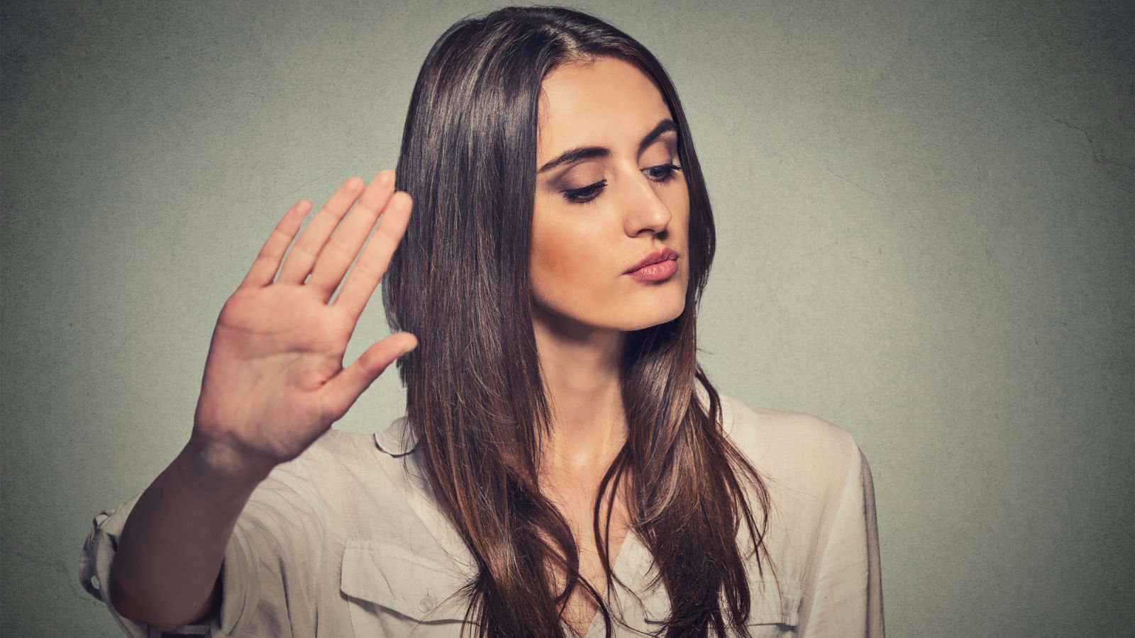 young annoyed angry woman with bad attitude giving talk to hand gesture stop esb professional shutterstock