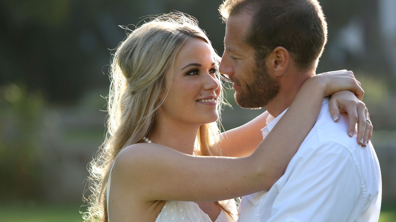 young happy couple together engaged engagement phase4studios shutterstock