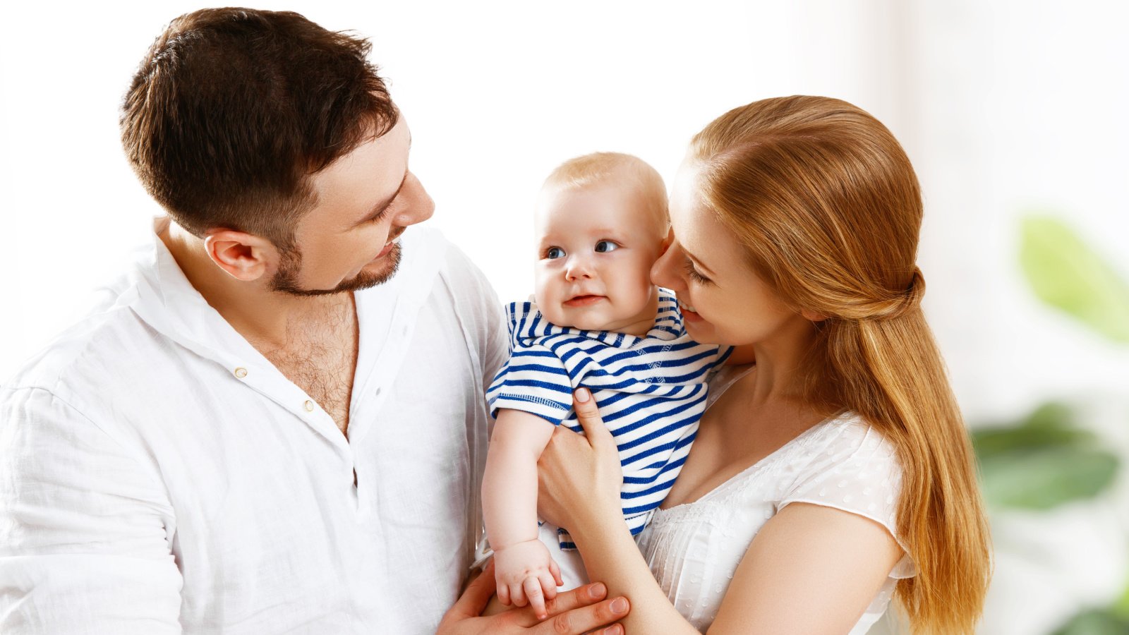 young parents father mother baby Evgeny Atamanenko shutterstock