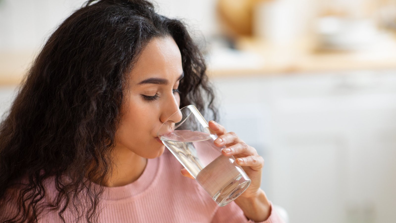 young woman drinking water