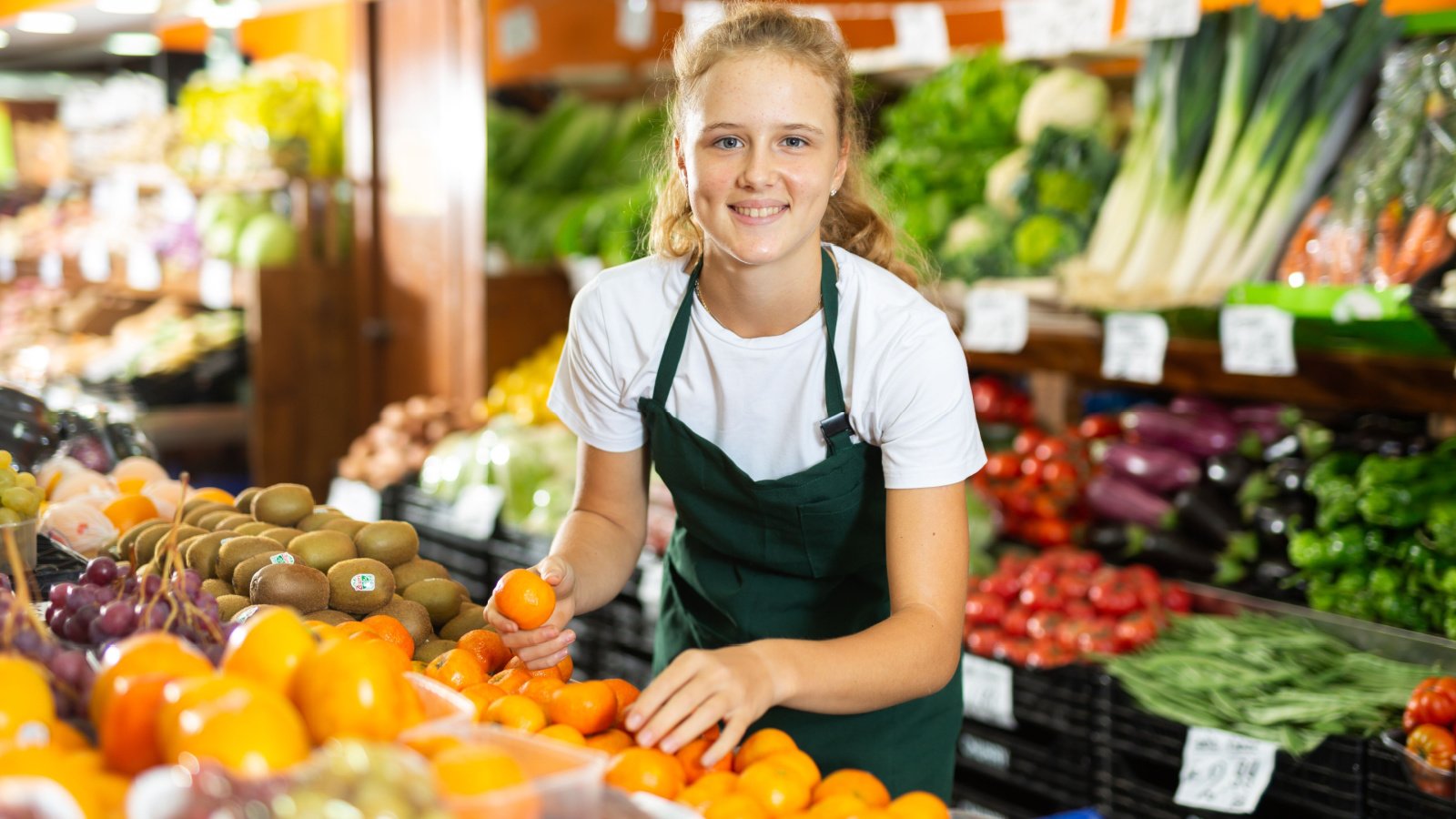 young woman grocery store jobs fruit produce BearFotos shutterstock