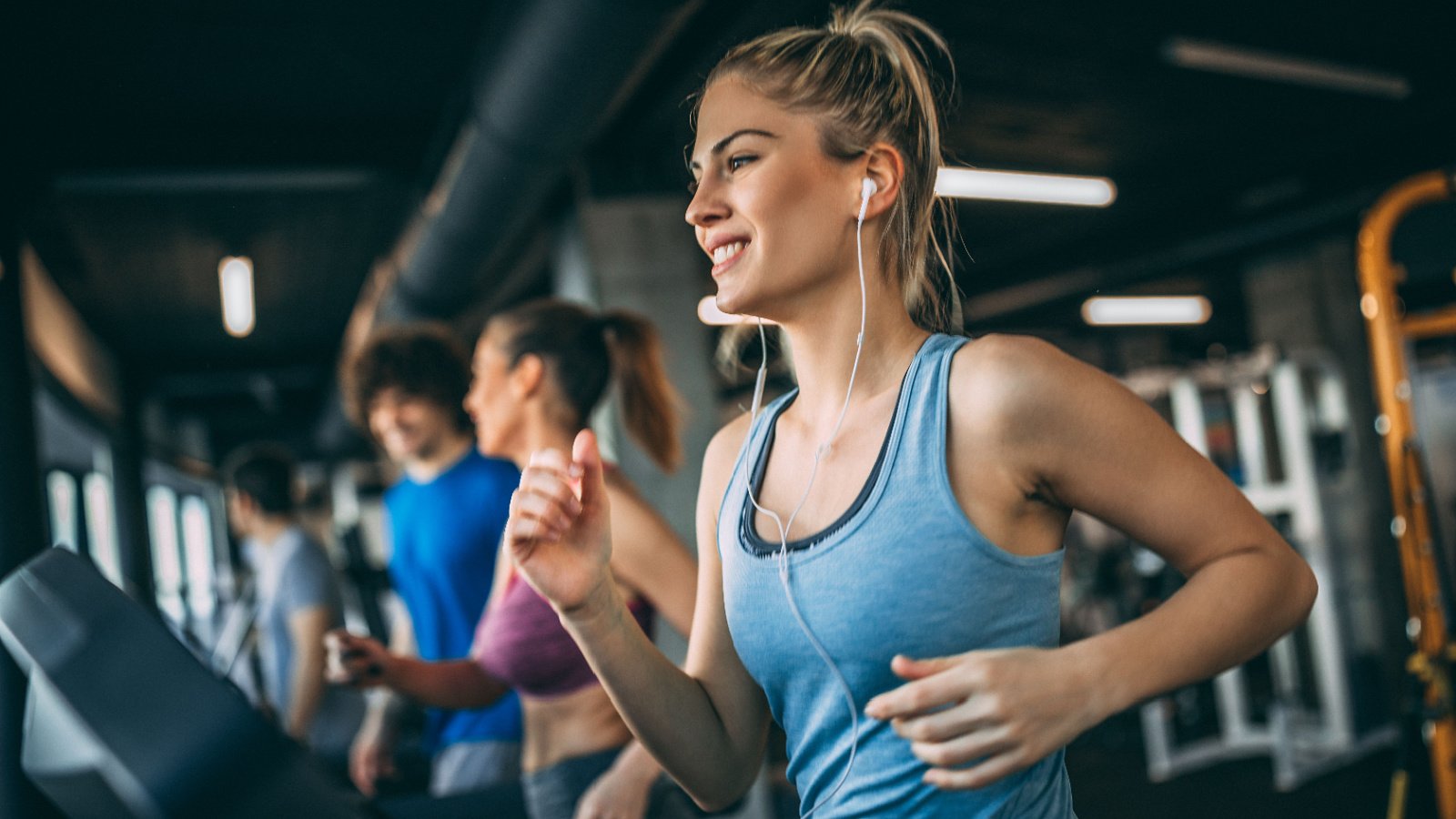 young woman running at gym workout health fitness