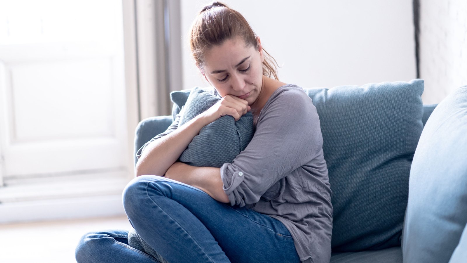 young woman tired worried stressed grief guilt sad depressed troubled sb arts media shutterstock