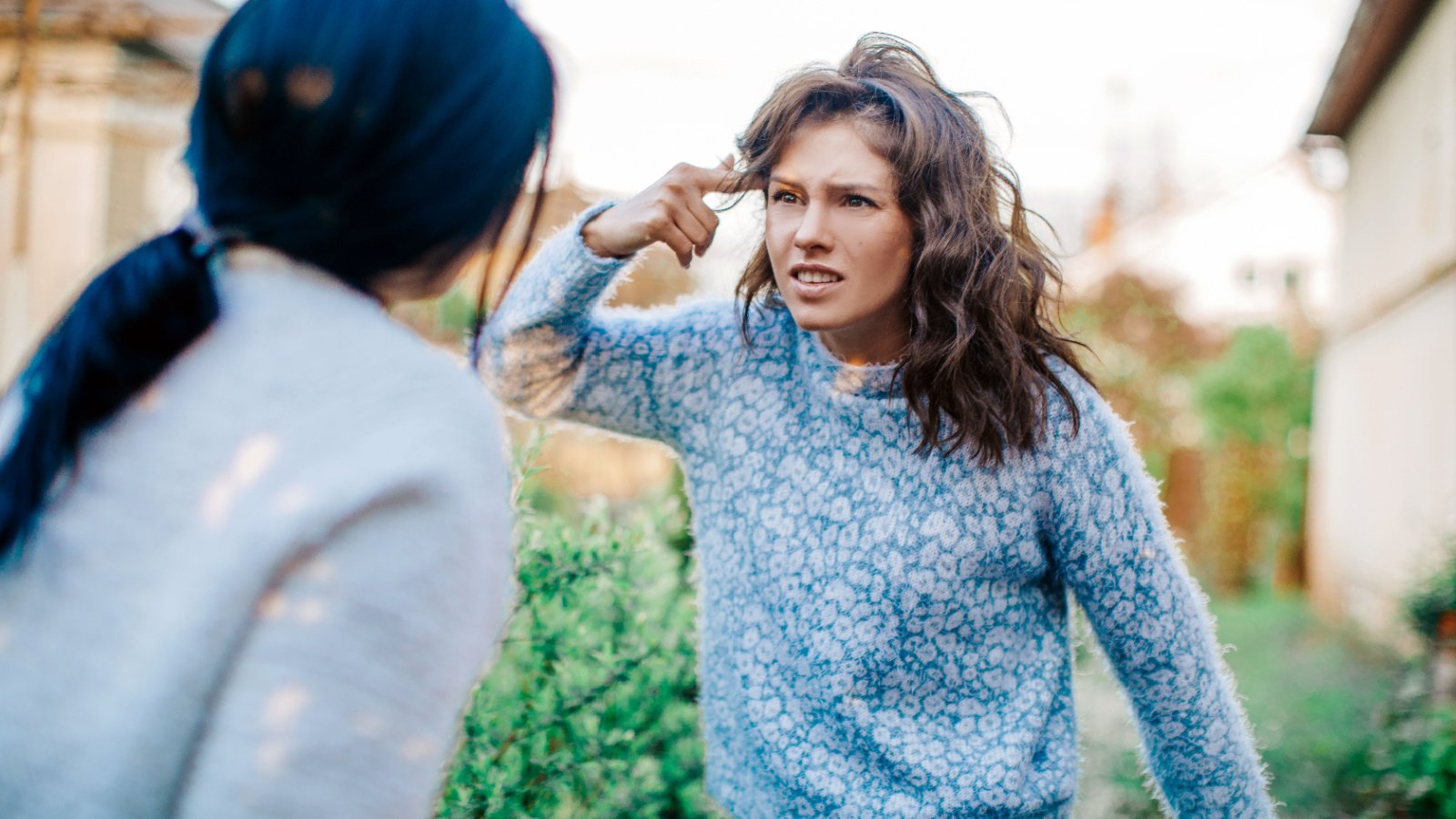 young women arguing fighting Aloha Hawaii shutterstock