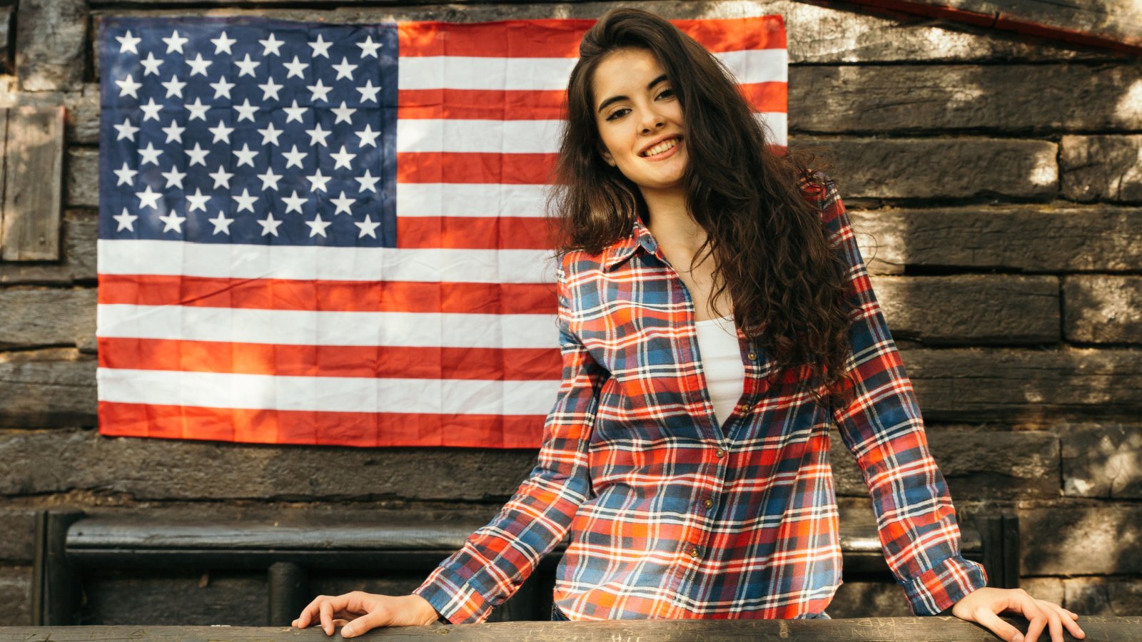 young ylady wave american flag politics election country barn enrique arnaiz lafuente shutterstock